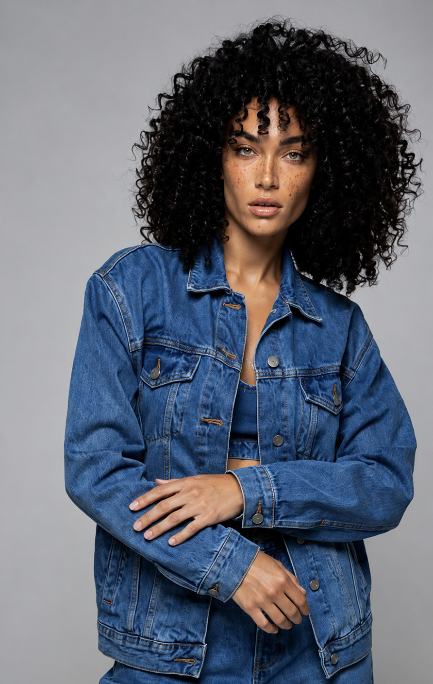 Layla Rey portrait in a denim jacket, soft studio light